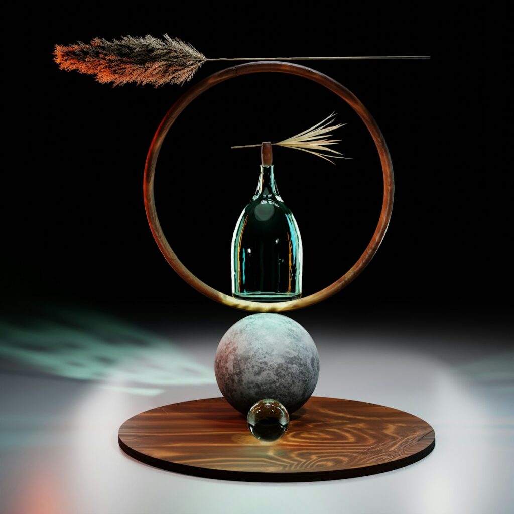 a glass vase and a rock on a table